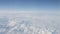Airplane shot, flying over white clouds over europe