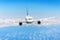 Airplane in the sky above the clouds flight journey sun height speed motion blur. Passenger commercial aircraft.