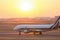 Airplane on a starting runway evening sundown