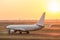 Airplane on a starting runway evening sundown