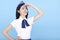 Airplane stewardess young woman looking far away isolated on blue background