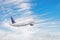 Airplane takes off against the background of clouds