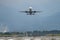 Airplane taking off from the airport, mountains on background. Transportation concept