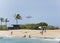 Airplane taking off over the beach