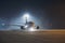 Airplane taxiing at airport during heavy snowfall