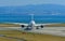 Airplane taxiing on runway of Kansai Airport