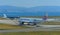 Airplane taxiing on runway of Kansai Airport