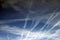 Airplane tracks sprayed in a morning sky