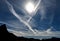 Airplane trails fill the sky over Zion National Park