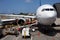 Airplane Unloading the Luggages at the Airport