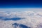 Airplane view of beautiful blue sky horizon with clouds