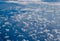 Airplane view to Altocumulus clouds and shadows of them above sea surface.