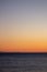 Airplane wake at sunset with the background of the mountains