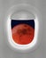 Airplane Window Looking at Moon