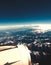 Airplane window photo of the plane turbine and the alps