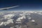 Airplane Wing and Clouds Viewed from Inside the Aircraft. Travel concept with copy space