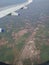 Airplane wing, express higway road nd fields aerial view from aeroplane window