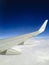 Airplane Wing in Midnight Blue Sky with Clouds