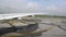 Airplane wing and runway, view from plane window