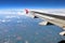 Airplane Wing View Of Clouds And Earth