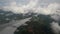 Airplane wing view at sky with clouds