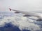 Airplane wings in the sky and clouds - image