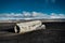 Airplane wreckage Solheimasandur Iceland on black sand beach