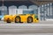 Airplane yellow pushback truck in moving at airport