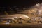 Airplanes at an airport at night