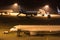 Airplanes at an airport at night