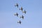 Airplanes performing acrobatic flight on blue sky