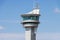 Airport air traffic control tower. Flights management center. Isolated blue sky background