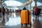 Airport ambiance A luggage bag blends into the bustling, blurred background