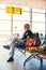 Airport attractive old man tourist boarding plane taking a flight  wearing face mask. Coronavirus flu virus travel