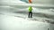 Airport employee removes snow near aircraft by shovel