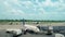 Airport employees preparing the boeing before the flight. Aircraft with blue sky on the background