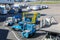 Airport ground handling support equipment, vehicles, tugs, stairs, dollies for cargo pallets at Amsterdam Airport Schiphol AMS