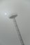 Airport light tower in the fog