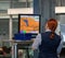 Airport, munich, germany, 2019 april 09: women in uniform standing at counter at checking point and watching at monitor with x-ray
