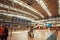 Airport passenger looks at the aircraft departure board in huge space for travelers