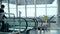 airport passenger passing through the control turnstile.