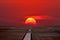 Airport runway in the crimson sunrise