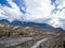 Airport runway in the mountain valley with the overcast weather snow mountain as background, Jomsom