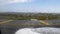 Airport runway view sign no entry through moving plane window before the departure with rain drops