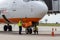 Airport service inspects and refuel an aircraft during parking