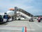 Airport stair vehicle and passengers boarding the aircraft