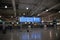 Airport terminal building interior. Checkin counters and blue information signs. Athens Greece