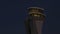 Airport tower at sunset with moon aerial view