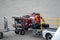 Airport worker loads luggage on a loader conveyor