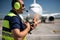 Airport worker using headset for speaking